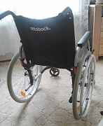 Инвалидная коляска и биотуалет